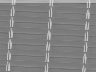 SEM-image of Stencil-mask with array of recangular-frames and 15° sidewall-tapering.